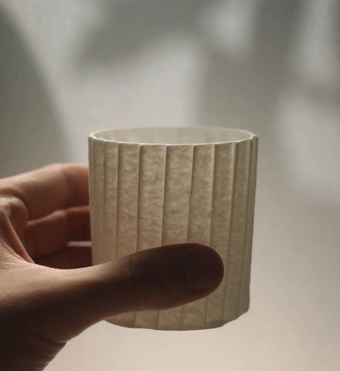 Kilnora Lumora Stonefold Series 220 ml porcelain cup featuring handcrafted rock-fold textures and soft translucence.