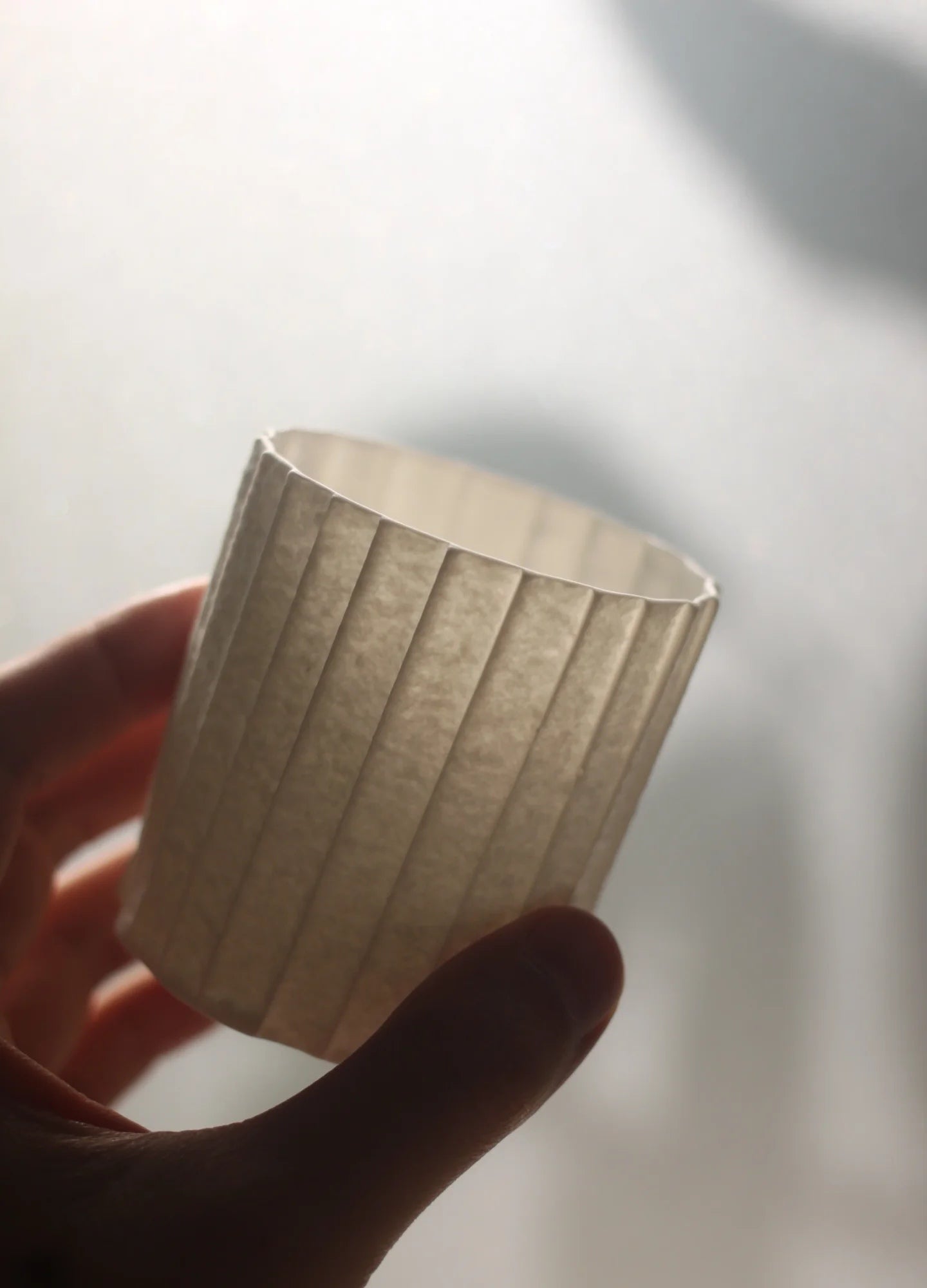 Kilnora Lumora Stonefold Series 220 ml porcelain cup featuring handcrafted rock-fold textures and soft translucence.