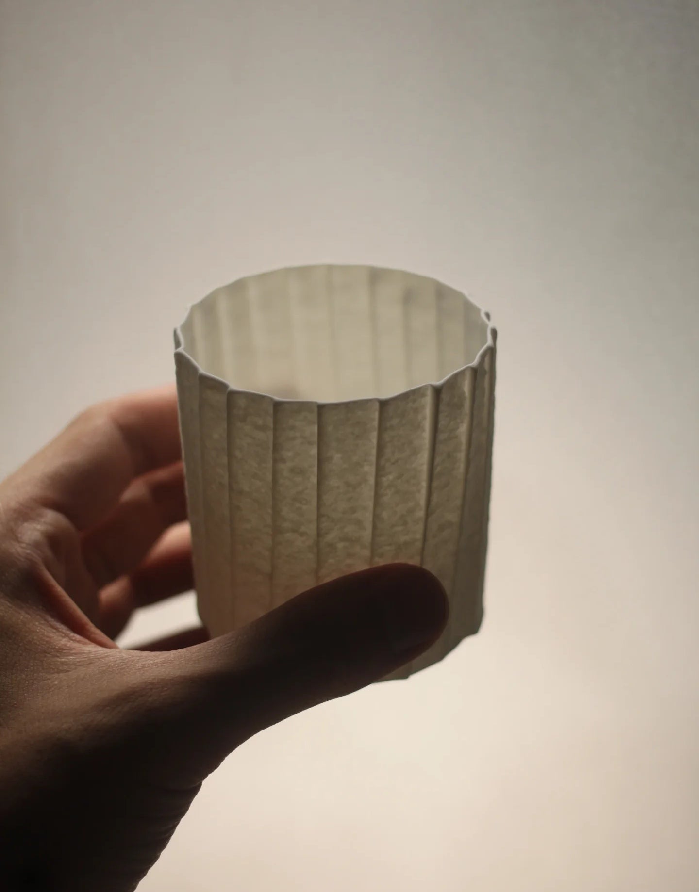 Kilnora Lumora Stonefold Series 220 ml porcelain cup featuring handcrafted rock-fold textures and soft translucence.