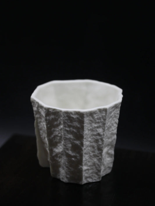 Kilnora Lumora Sekisen Series 180 ml porcelain cup with folded stone-inspired form and translucent paper-thin walls.