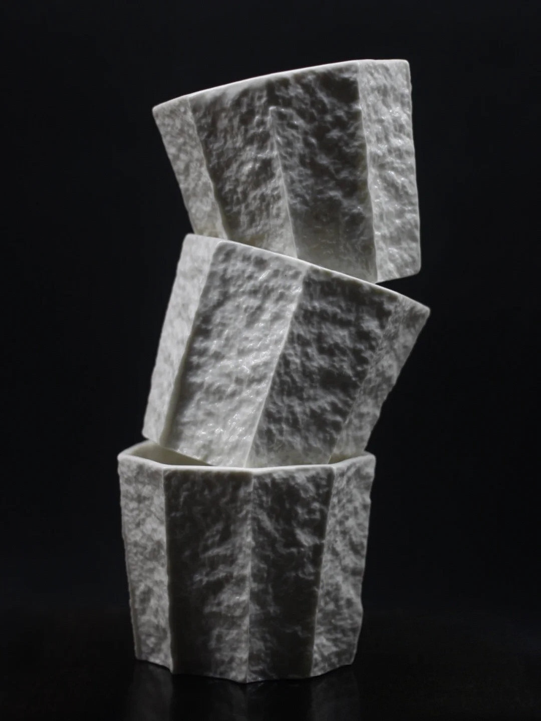 Kilnora Lumora Sekisen Series 250 ml porcelain cup with folded stone-inspired form and translucent paper-thin walls.
