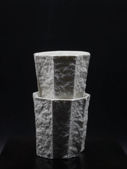 Kilnora Lumora Sekisen Series 250 ml porcelain cup with folded stone-inspired form and translucent paper-thin walls.
