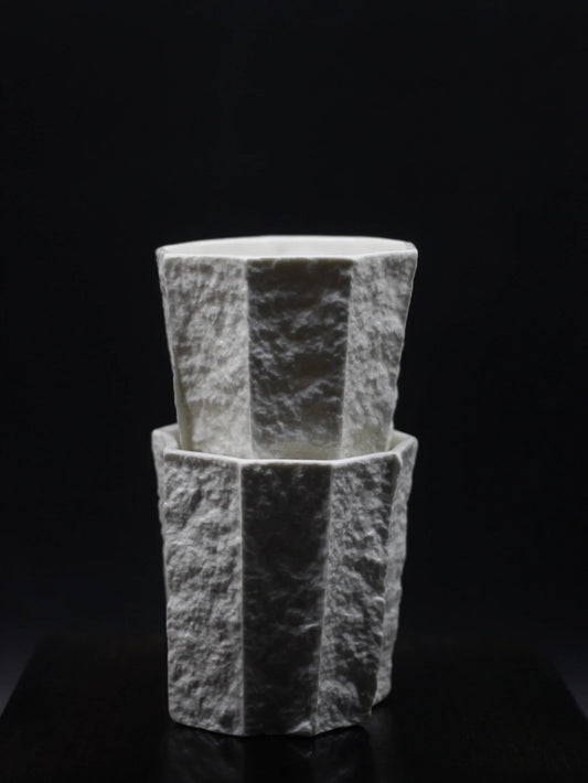 Kilnora Lumora Sekisen Series 250 ml porcelain cup with folded stone-inspired form and translucent paper-thin walls.