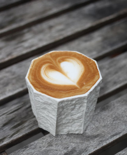 Kilnora Lumora Sekisen Series 180 ml porcelain cup with folded stone-inspired form and translucent paper-thin walls.