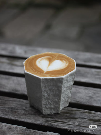 Kilnora Lumora Sekisen Series 180 ml porcelain cup with folded stone-inspired form and translucent paper-thin walls.