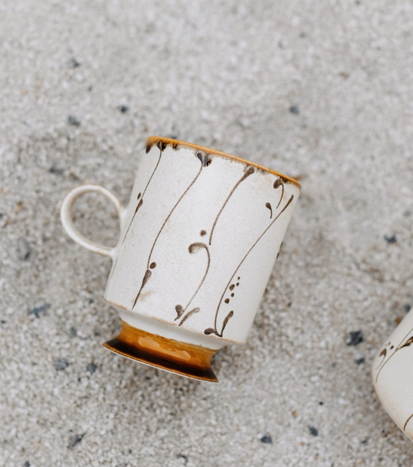 Kilnora Sōng Amber Series coffee cup featuring rich amber glaze and delicate relief patterns