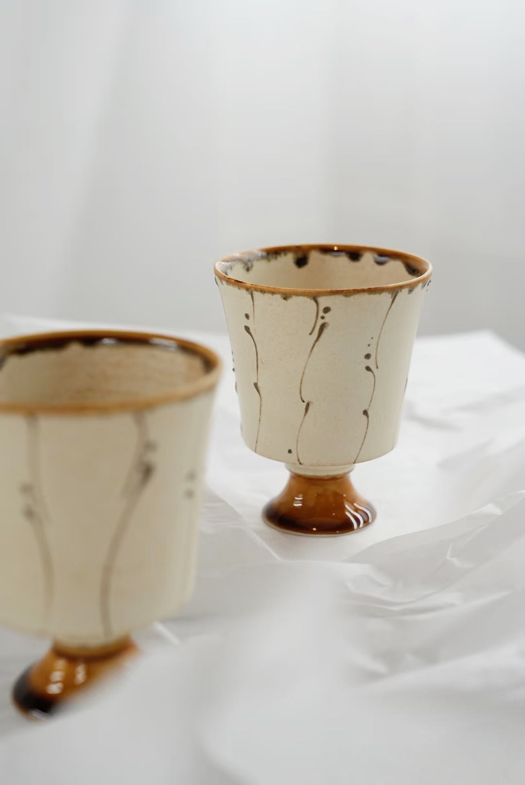 Kilnora Sōng Amber Series stemmed goblet with translucent amber glaze and elegant silhouette