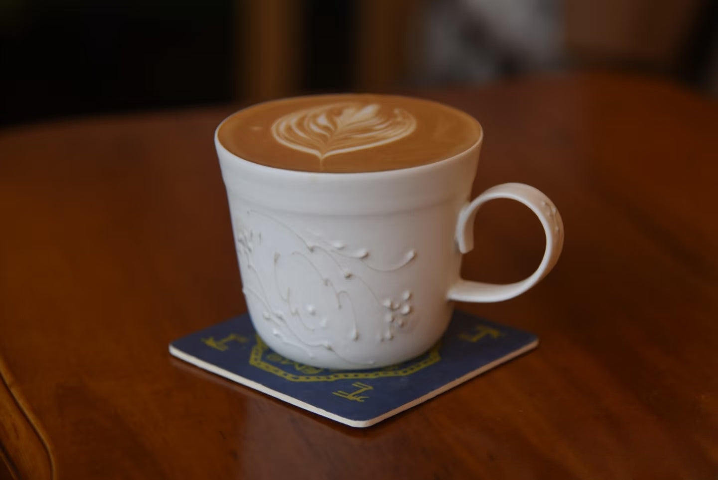 Kilnora Sōng Dandelion Series matte white handled coffee cup featuring custom slip decoration and soft matte finish