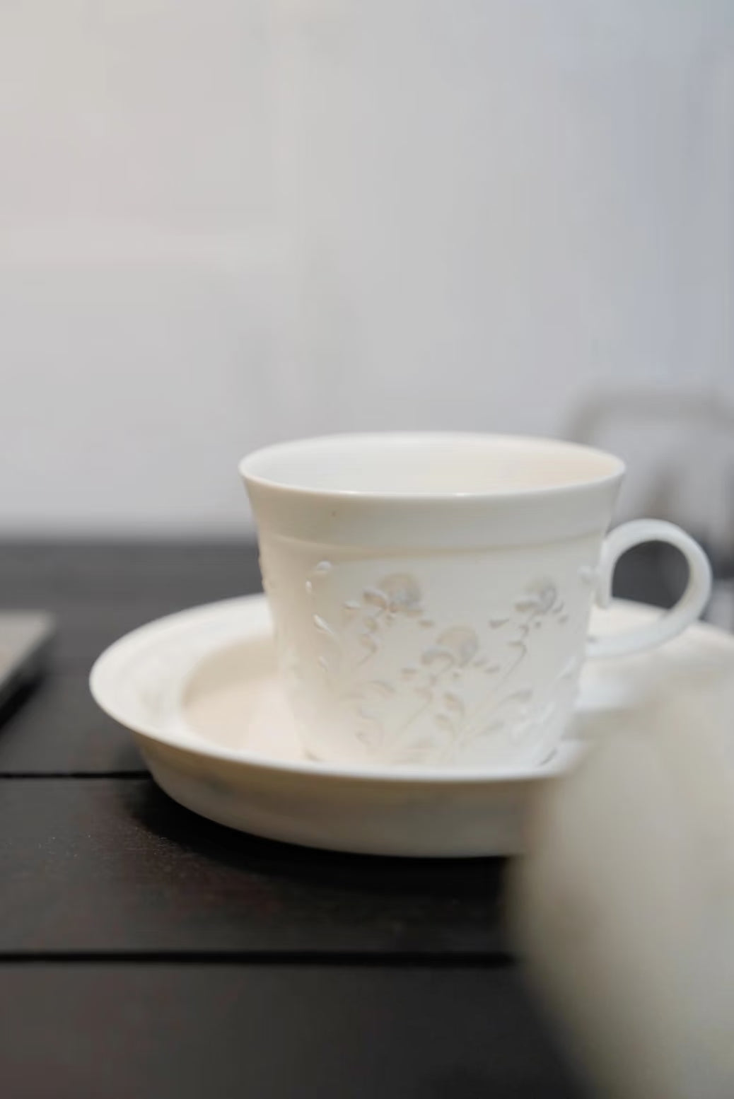 Kilnora Sōng Dandelion Series matte white handled coffee cup featuring custom slip decoration and soft matte finish