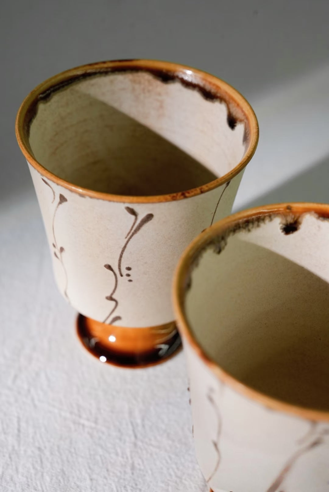 Kilnora Sōng Amber Series stemmed goblet with translucent amber glaze and elegant silhouette