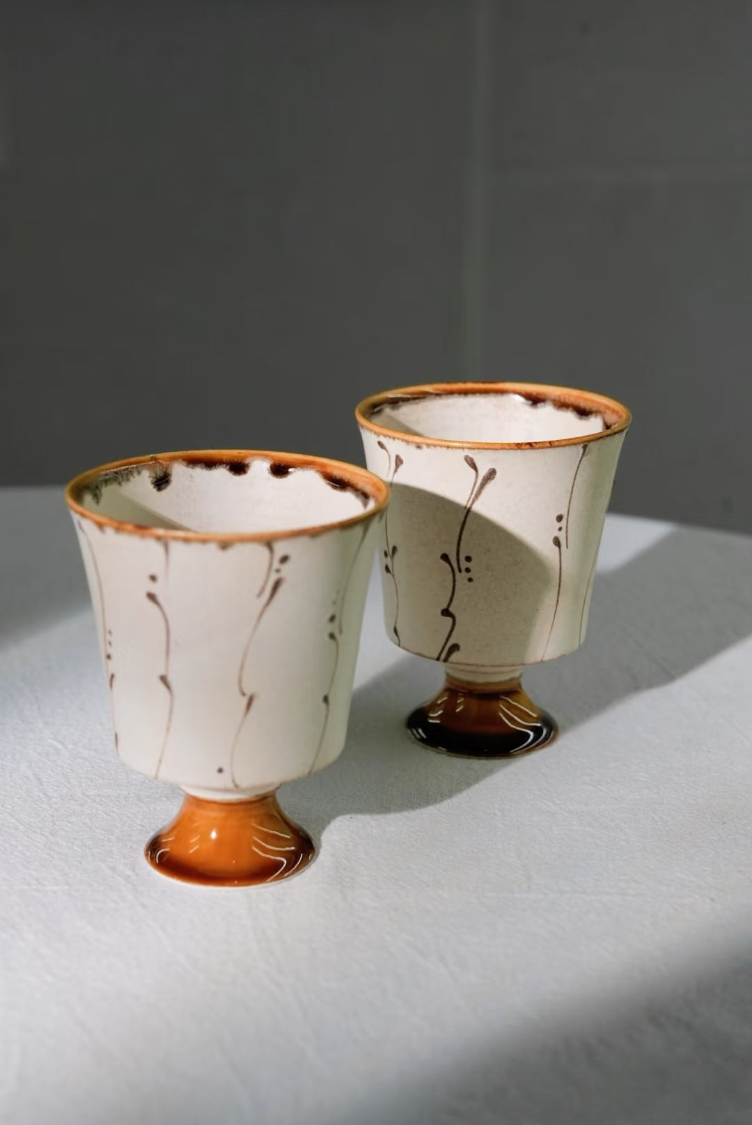 Kilnora Sōng Amber Series stemmed goblet with translucent amber glaze and elegant silhouette