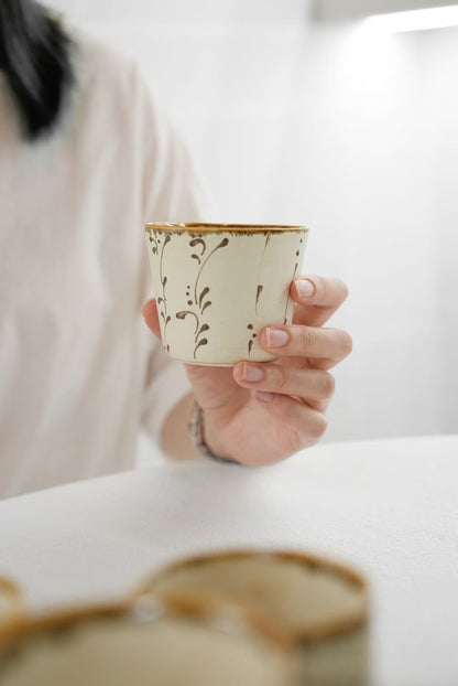 Kilnora Sōng Amber Series ceramic Chyongku cup with warm amber glaze and hand-painted slip motifs