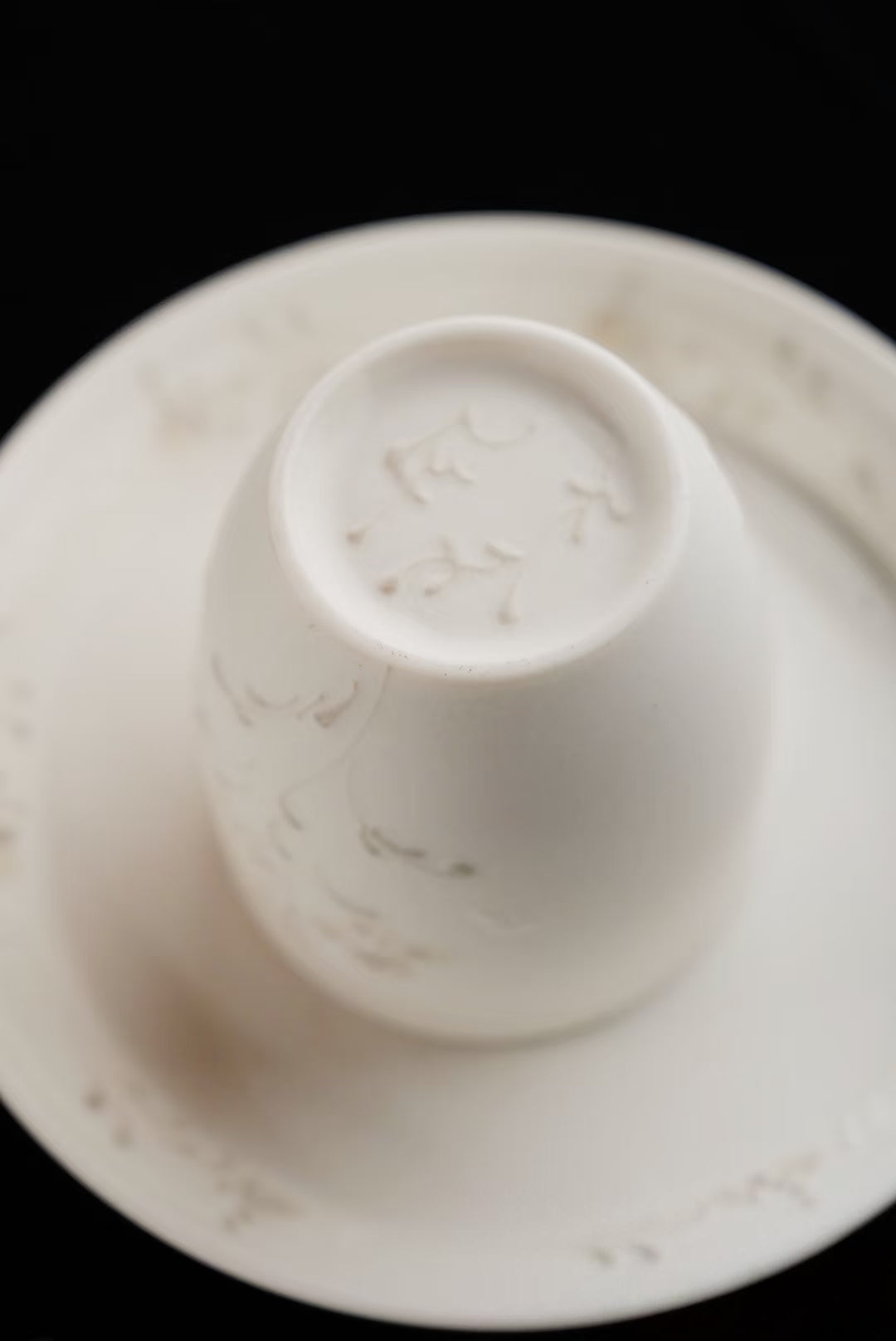 Kilnora Sōng Dandelion Series matte white ceramic cup showcasing delicate relief and minimalist design