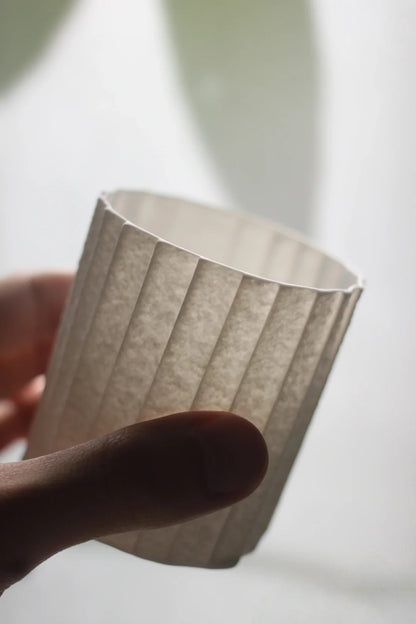 Kilnora Lumora Stonefold Series 220 ml porcelain cup featuring handcrafted rock-fold textures and soft translucence.