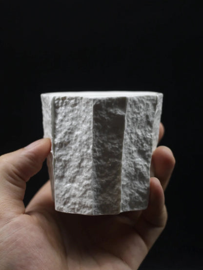 Kilnora Lumora Sekisen Series 180 ml porcelain cup with folded stone-inspired form and translucent paper-thin walls.