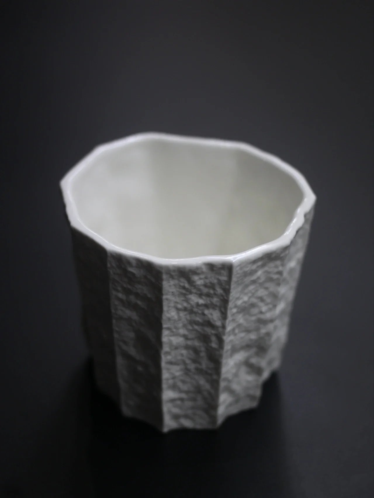 Kilnora Lumora Sekisen Series 180 ml porcelain cup with folded stone-inspired form and translucent paper-thin walls.