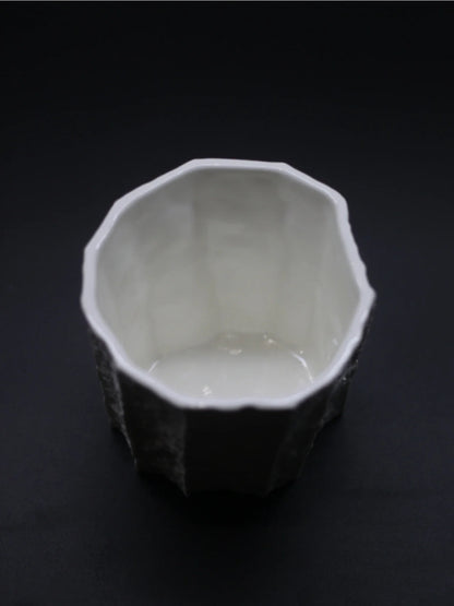 Kilnora Lumora Sekisen Series 250 ml porcelain cup with folded stone-inspired form and translucent paper-thin walls.