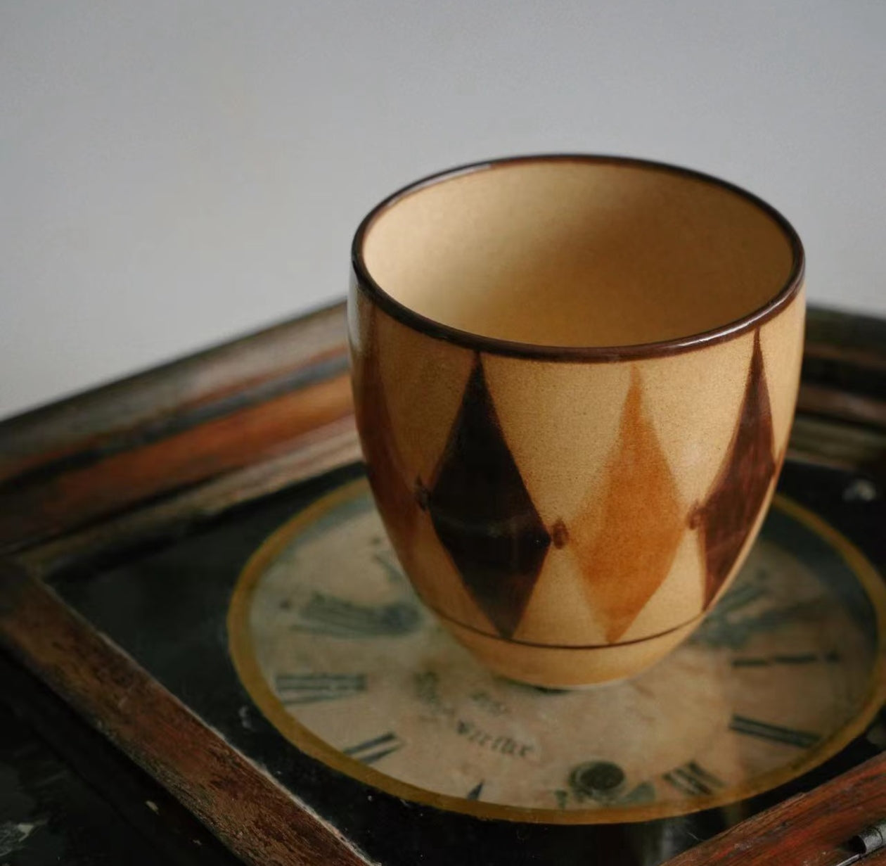 Kilnora Shisō diamond-shaped porcelain cup with geometric underglaze motifs