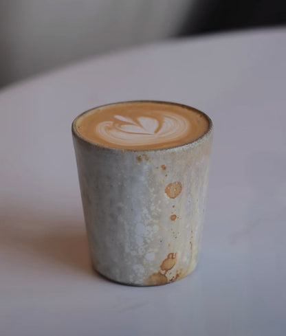 Kilnora Kyūshō Series white slip porcelain cup with straight sides and flame-textured rim.