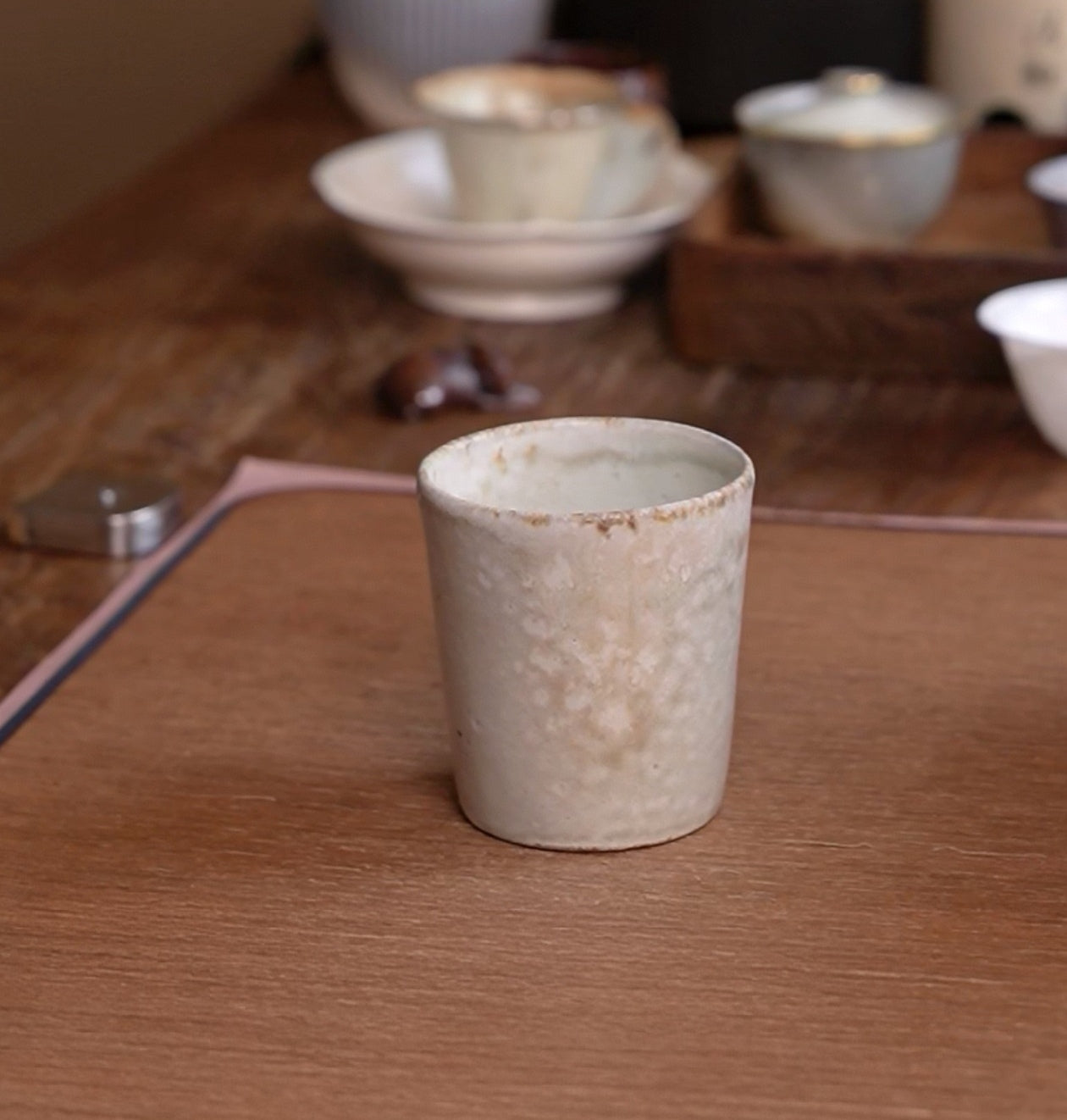 Kilnora Kyūshō Series white slip porcelain cup with straight sides and flame-textured rim.